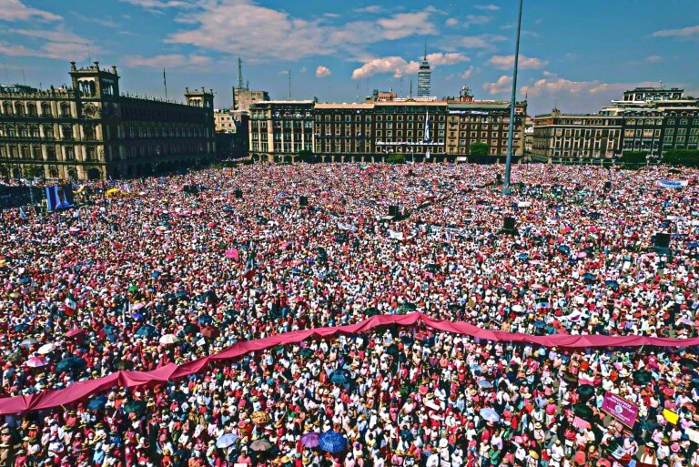 Massive crowd gathered in Zócalo, Mexico City during event.