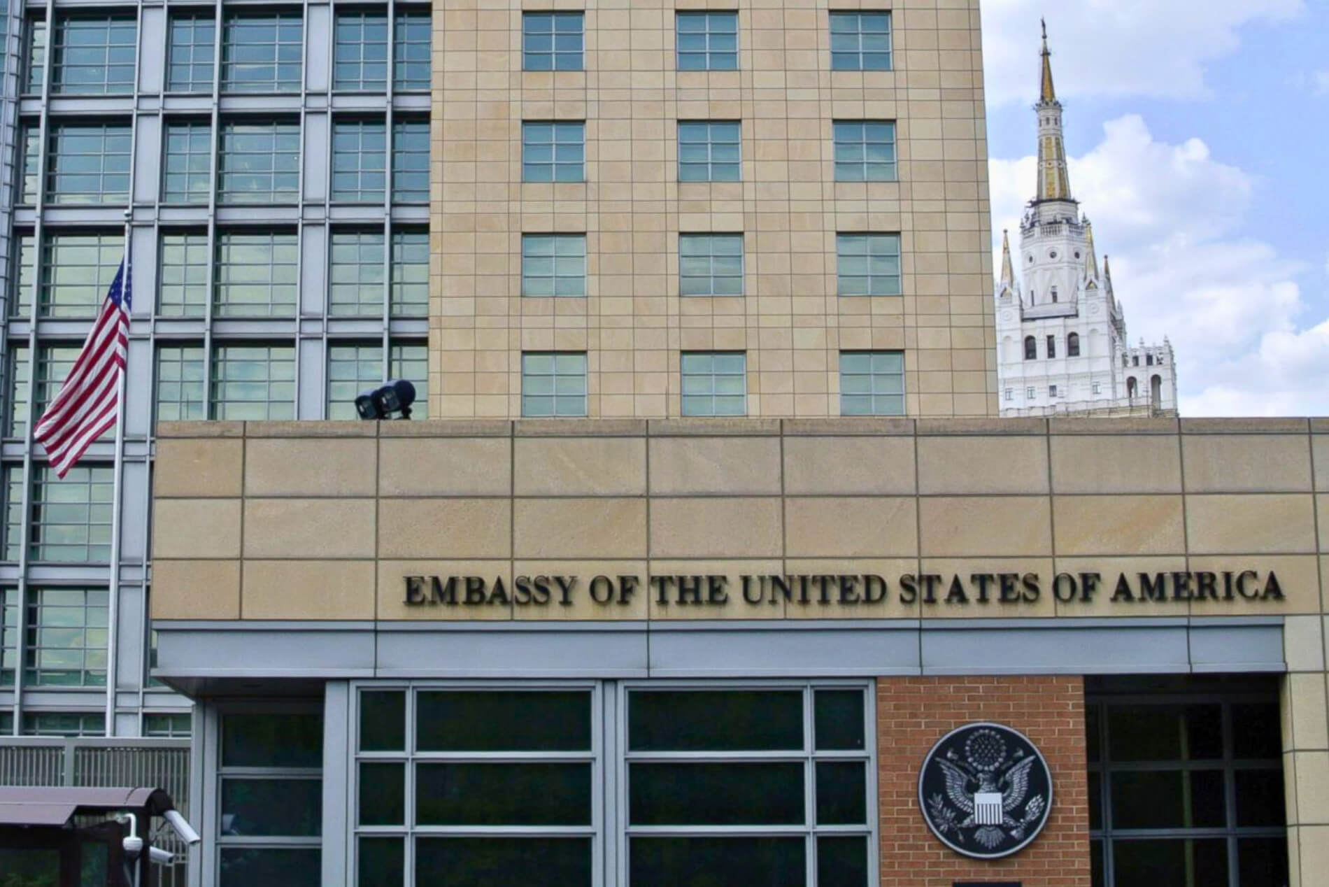 U.S. Embassy building with American flag.