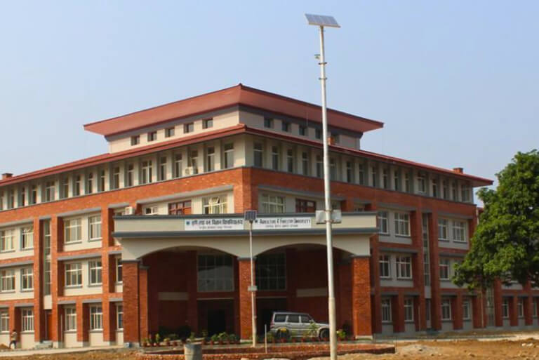 Red brick academic building with solar panel.