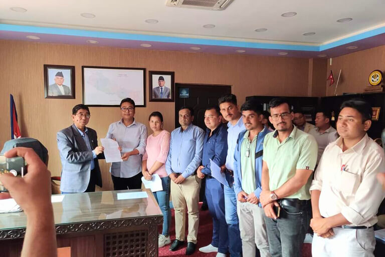 Group of people presenting document in office.